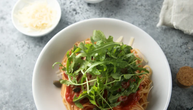 Espaguetis con rúcula