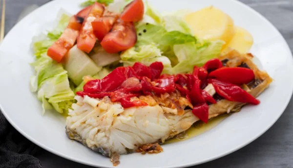 Merluza con pimientos