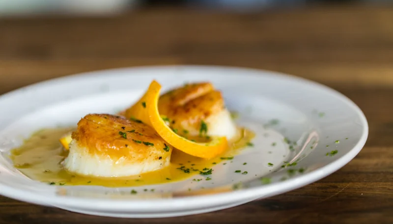 Vieiras con salsa de naranja